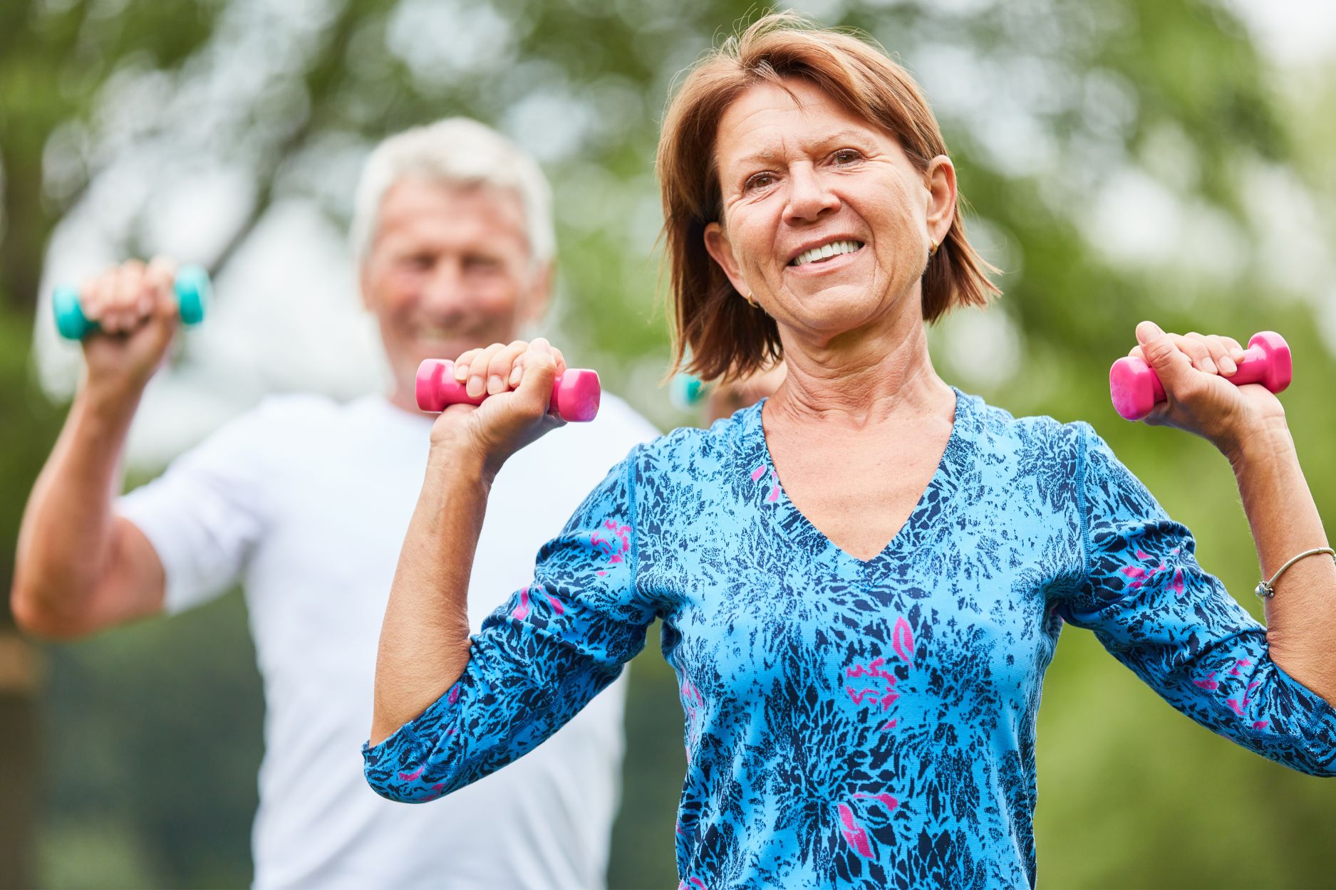 active senior couple during strength training